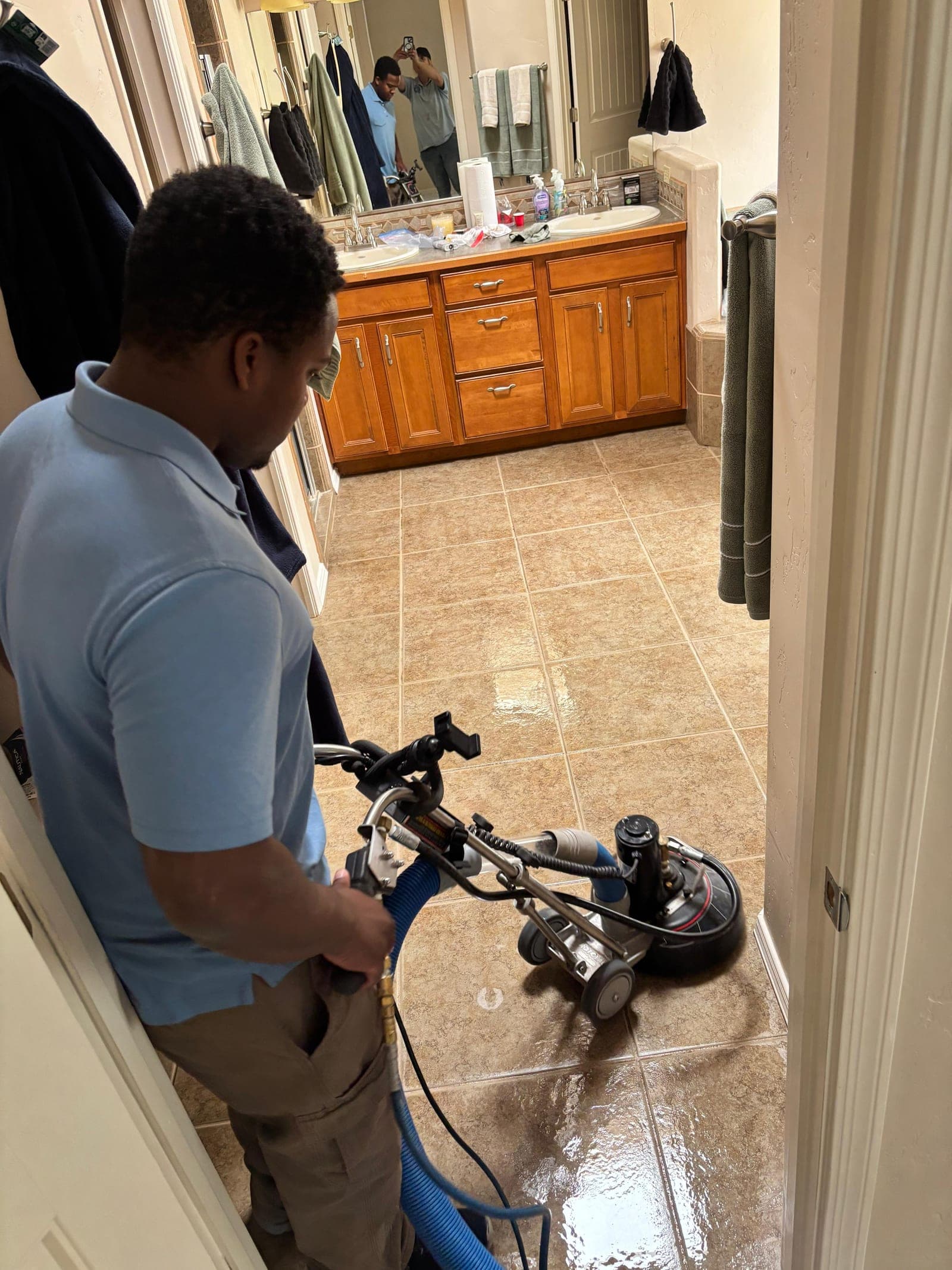 Bathroom tile floor cleaned during a tile and grout cleaning job in Las Cruces, NM