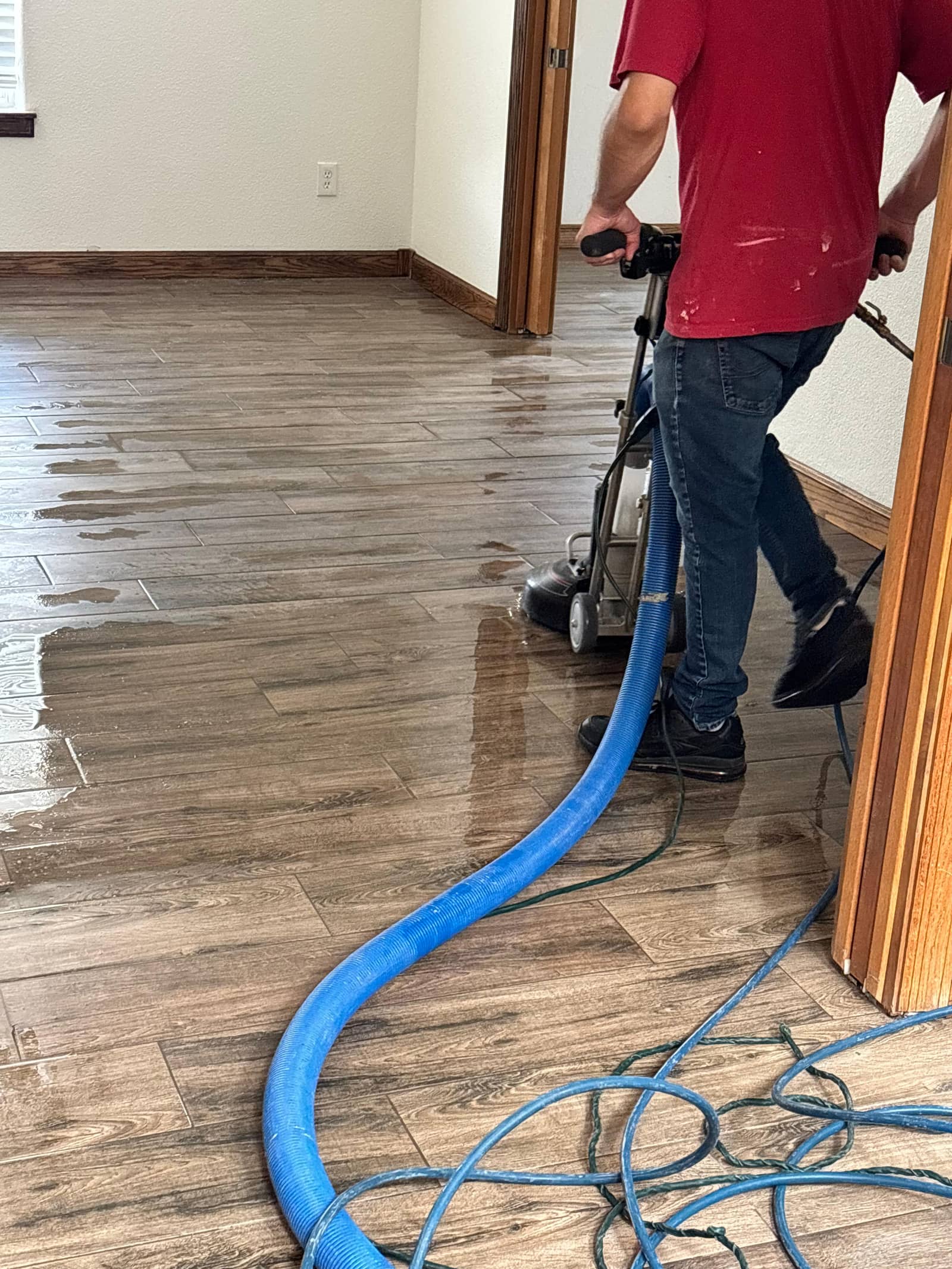Technician cleaning a hard floor in Las Cruces, NM