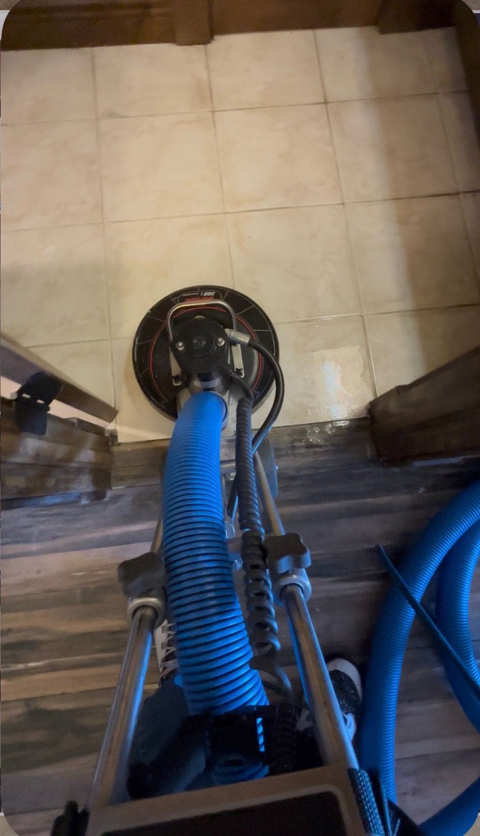 Rotary machine cleaning tile and grout lines during a job in Las Cruces, NM
